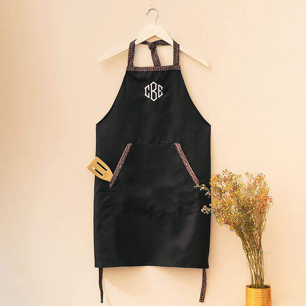 black with leopard monogrammed apron on hanger