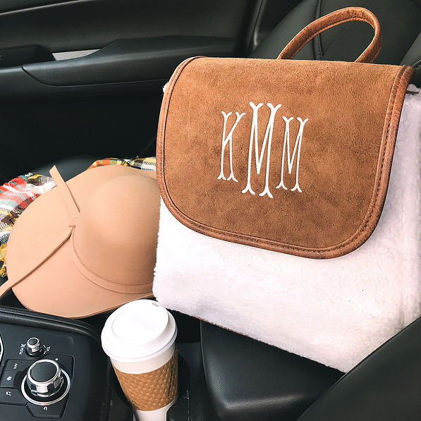 mini monogrammed sherpa backpack in car