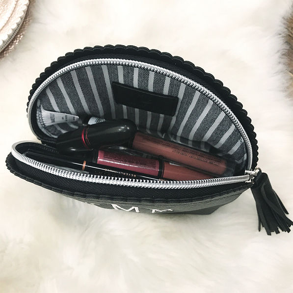 inside of black scalloped cosmetics case