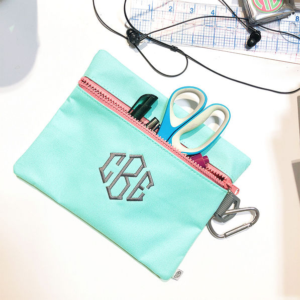 monogrammed mint pouch on desk