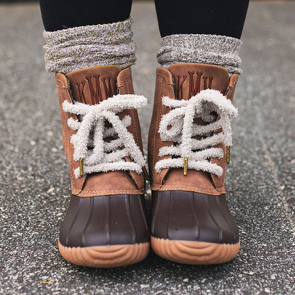 gray sherpa shoe laces on brown monogrammed duck boots