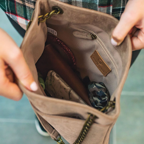 inside of monogrammed convertible suede bag
