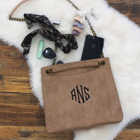 monogrammed convertible suede bag with accessories