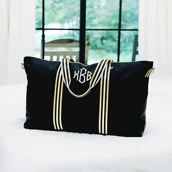 monogrammed black and gold weekend bag