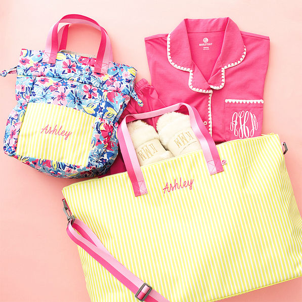 sunshine stripes weekend bag flatlay with toiletry bag and classic sleep set