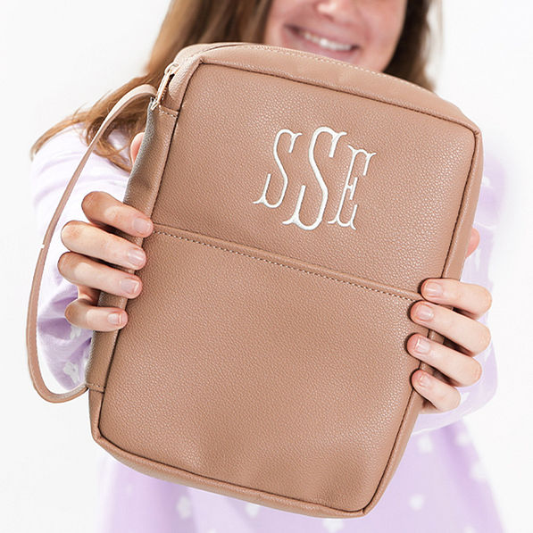 tan bible carrier in hands