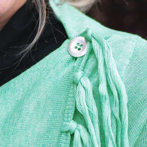 branded button on monogrammed crossover cardigan