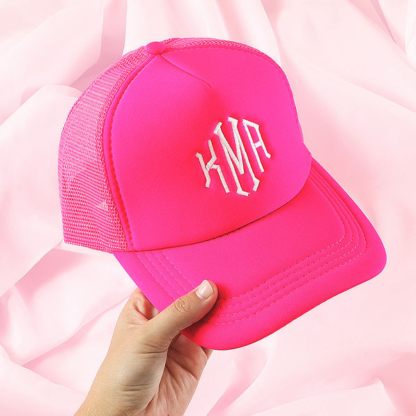 hot pink trucker hat on pink sheet