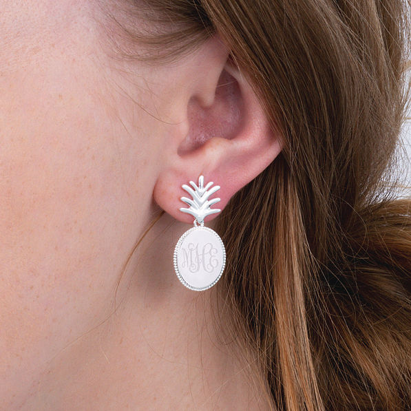 silver monogrammed pineapple dangle earrings in ear