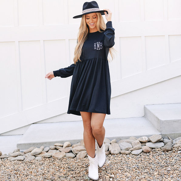 girl wearing monogrammed long sleeve black t shirt dress