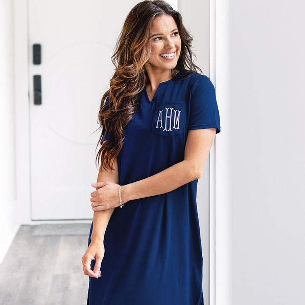 close up of monogrammed navy midi dress