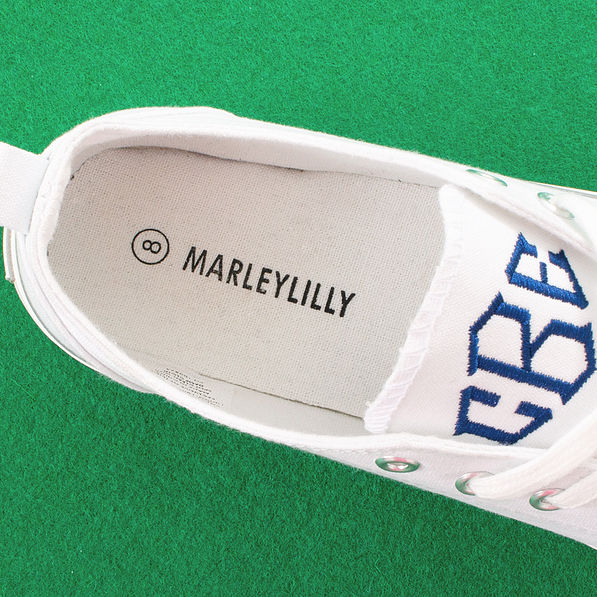 inside of monogrammed white canvas sneaker