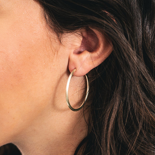 gold hoops in ear