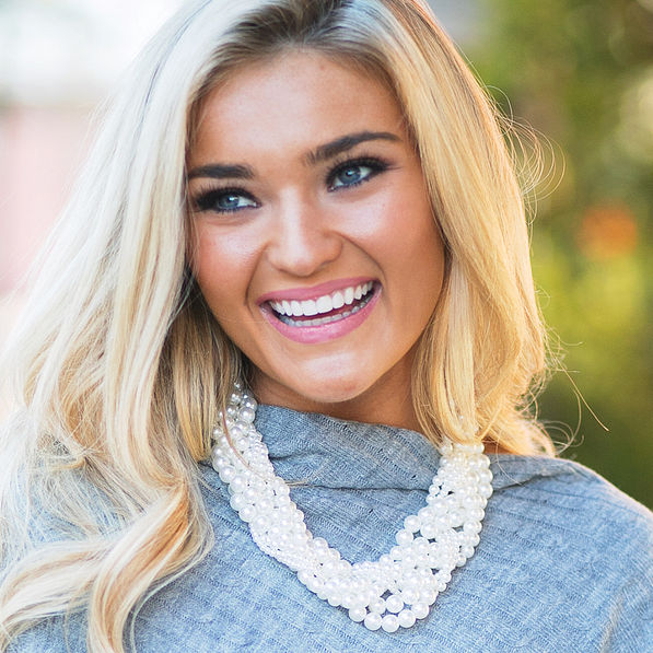 braided pearl necklace with monogrammed poncho