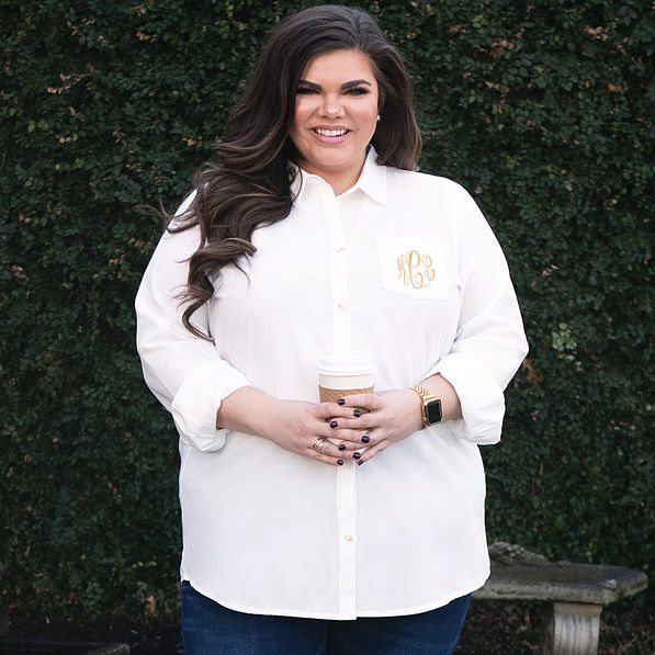 plus size model in white button down tunic