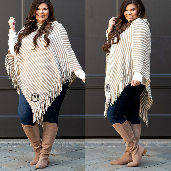 monogrammed striped fringe poncho with jeans and riding boots