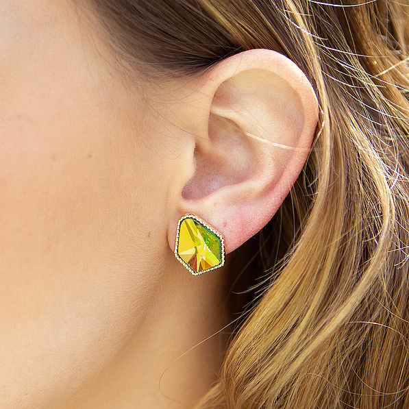 girl wearing diamond shape stud earrings