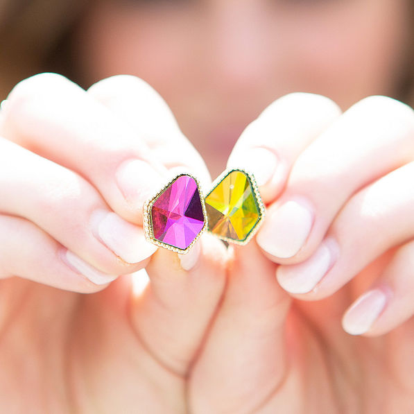 diamond shape stud earrings in hand