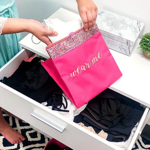 monogrammed confetti lingerie bag in closet