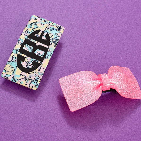 pink sparkle hair bow with multicolored hair clip