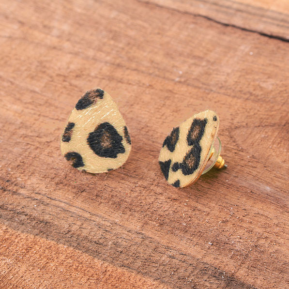 textured leopard print stud earrings on wood