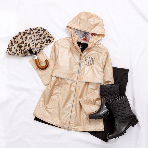 champagne rain jacket with boots and umbrella