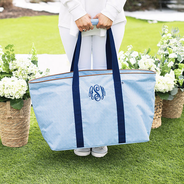 girl carrying personalized extra large tote bag in navy seersucker