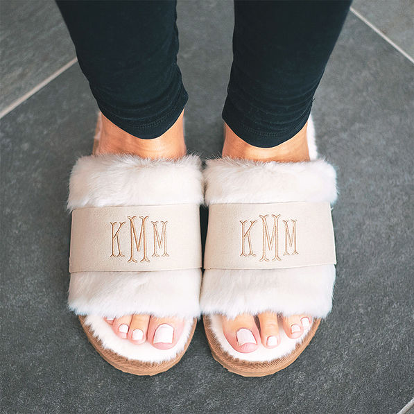 ivory monogrammed faux fur slippers