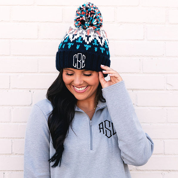 Close up of navy pom pom beanie