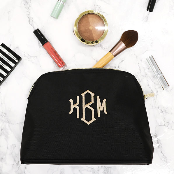 black nylon travel bag with makeup