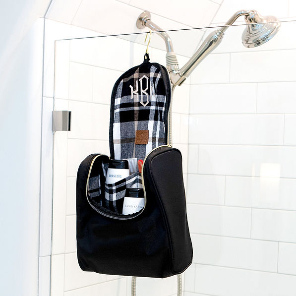 nylon toiletry kit hanging in bathroom