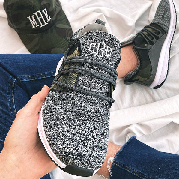 camo monogrammed sneakers in sitting with hat