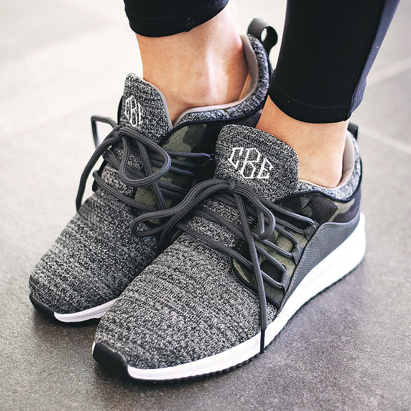 monogrammed camo sneakers with laces tied