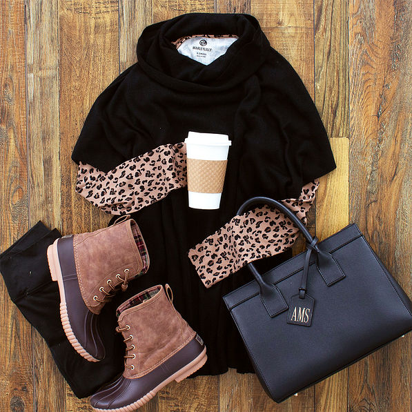 black short sleeve cowl neck poncho with duck boots and leopard top