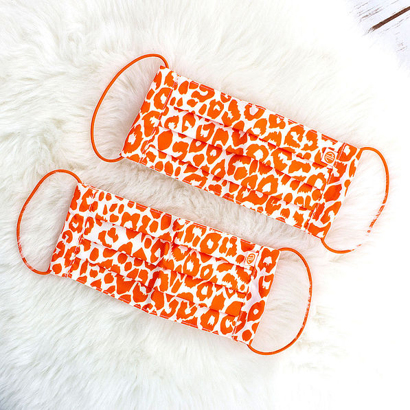 orange leopard face masks on rug