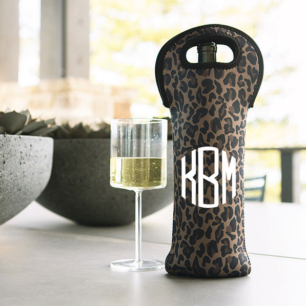 leopard monogrammed wine bag with wine glass on porch