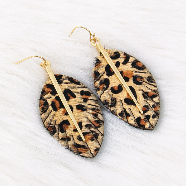 leopard feather earrings on faux fur