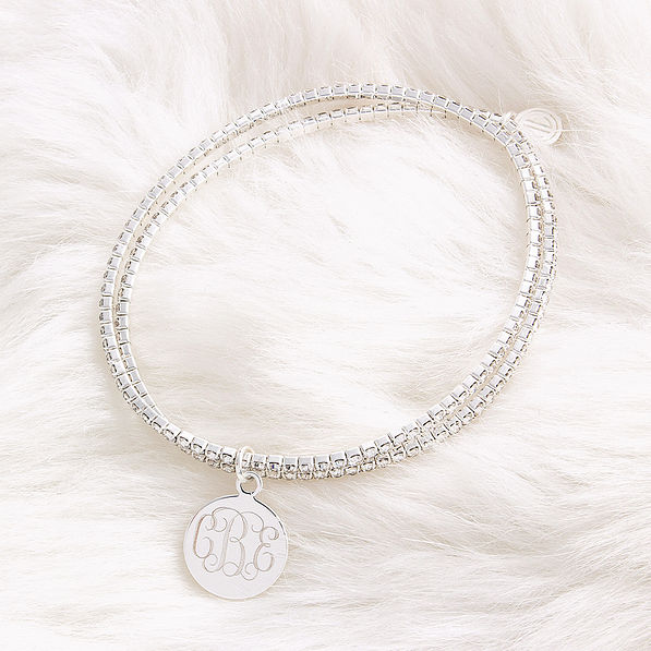 monogrammed bracelet set with rhinestones on fuzzy rug