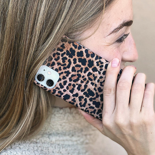 girl on phone with leopard case