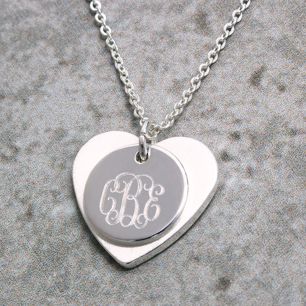 detail of monogram on layered heart necklace
