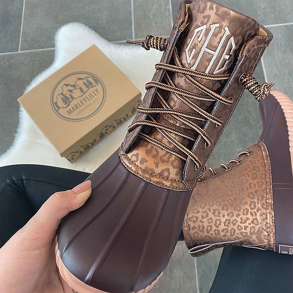 monogrammed metallic leopard duck boots sitting selfie