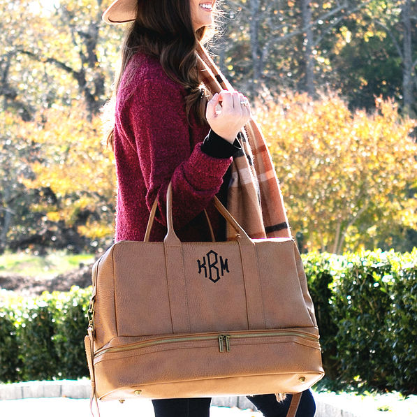 girl holding monogrammed duffel weekender