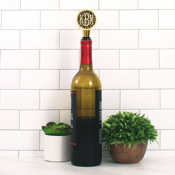 monogrammed leopard print wine stopper in bottle on counter