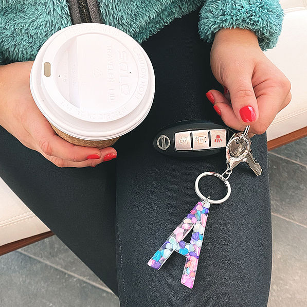 keys on letter A initial keychain with coffee in hand