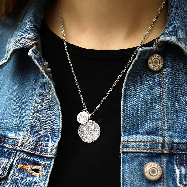 girl wearing monogrammed rhinestone pendant necklace with jean jacket