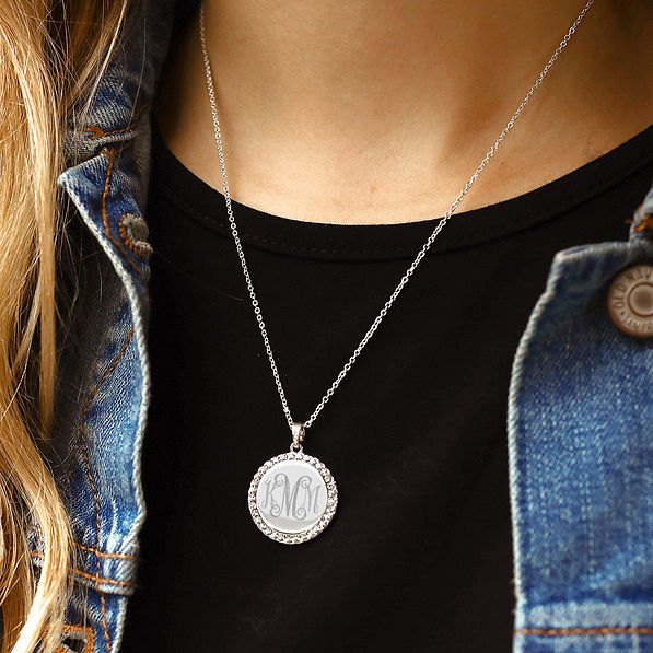 silver monogrammed rhinestone disc necklace with jean jacket