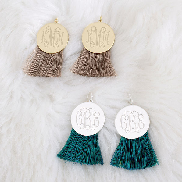 teal and mocha fringe disc earrings on faux fur