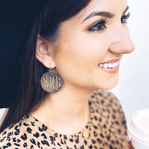 gold monogrammed brushed drop earrings with leopard top