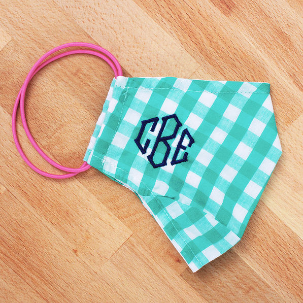 gingham monogrammed face mask on wood