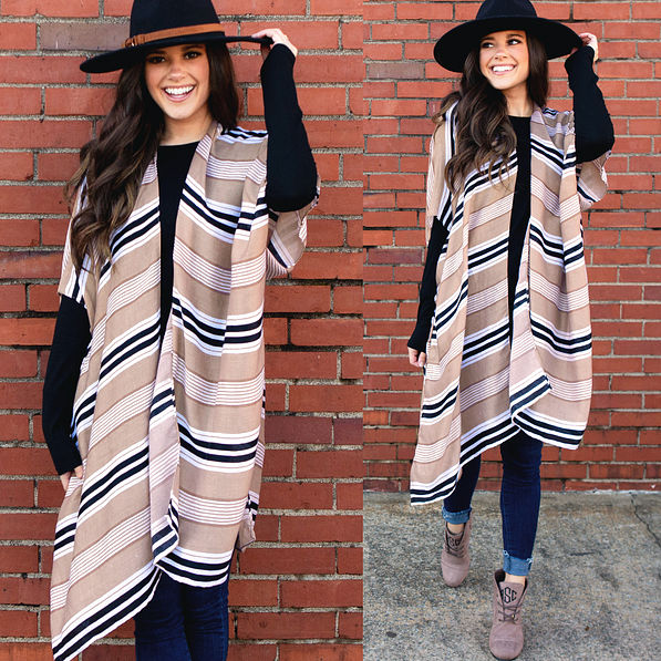 striped kimono with black shirt, jeans, monogrammed booties and wide brim hat